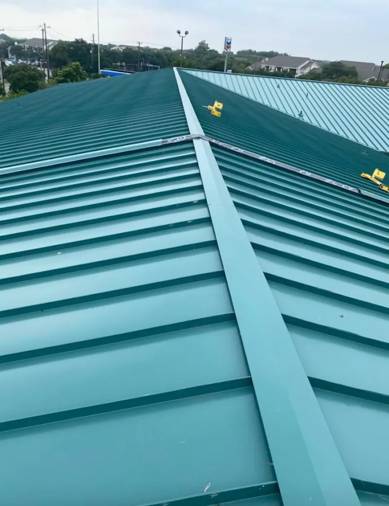 Green commercial metal roof ridge and valley for Metal Roof Repair in Oak Forest